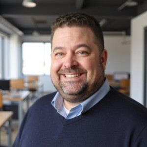 Color photo of Sean Sweeney (he/him), smiling