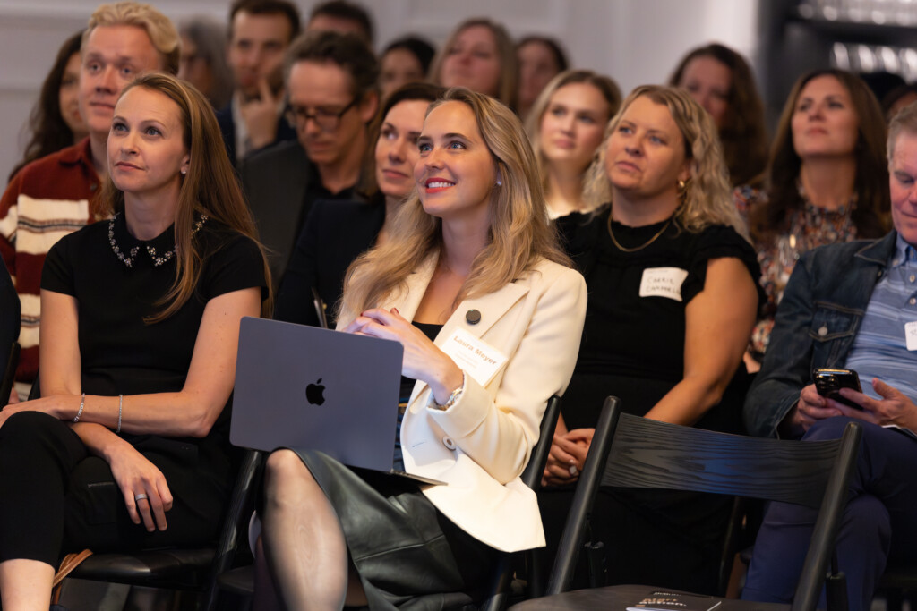 Speakers and audience listen as the 2026 Marketer of the Year award is presented at AMA Chicago's annual CMO Forum, held October 7, 2025.