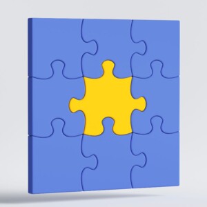 Graphic of a 9-piece jigsaw puzzle, all pieces are blue except the center one, which is bright yello